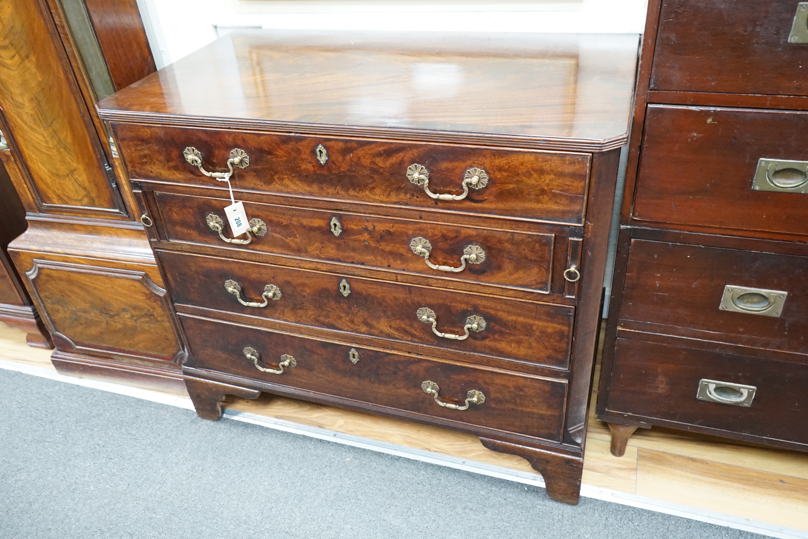 A George III and later mahogany dressing chest, the compartmented top drawer with sliding baize surface, width 98cm, depth 56cm, height 85cm *Please note the sale commences at 9am.